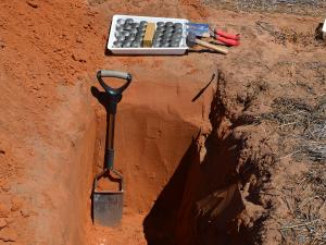Soil pit with sampling containers (Provided by Rodrigo Coqui da Silva)