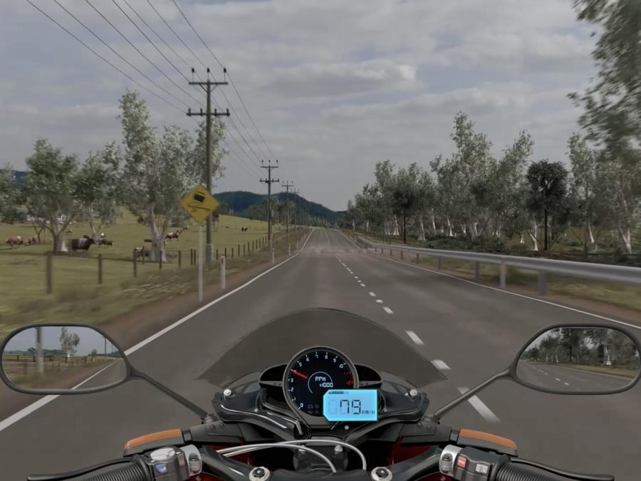 View of a long road over motorcycle handlebars