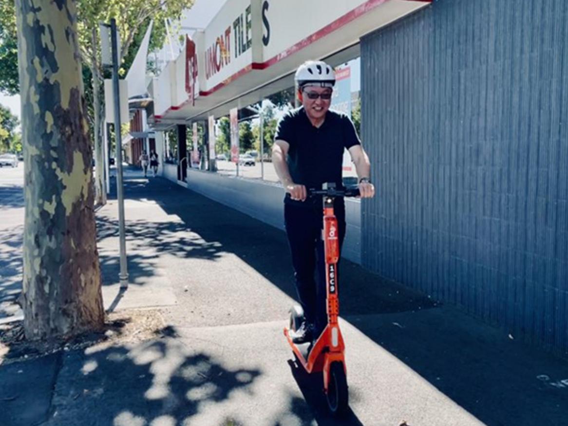 Image of rider on a Neuron e-scooter 