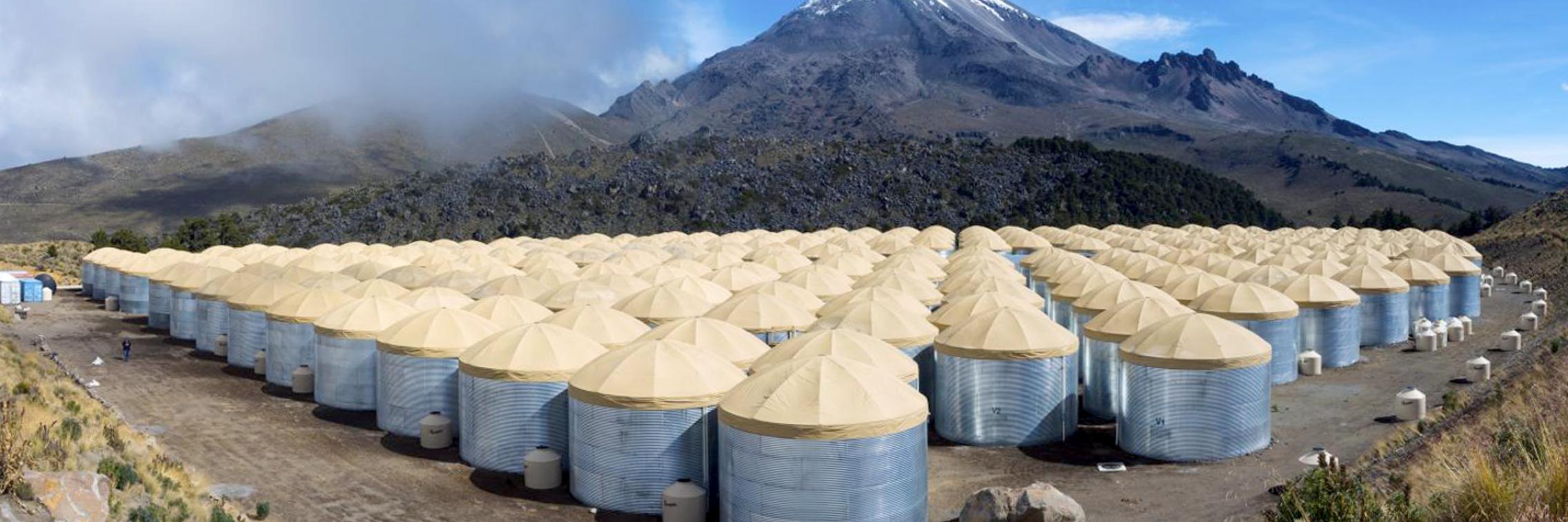 The High-Altitude Water Cherenkov Gamma-Ray Observatory on the slope of the Mexican Sierra Negra volcano. (Source: HAWC Observatory, J. Goodman)