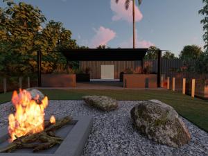 3d render of a backyard with a woodfire and rocks