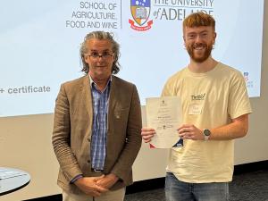 Alex Seward awarded Best questioner with Professor Jason Able, Head of School
