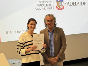 Tea Knezevic awarded Best Overall Presentation with Professor Jason Able, Head of School