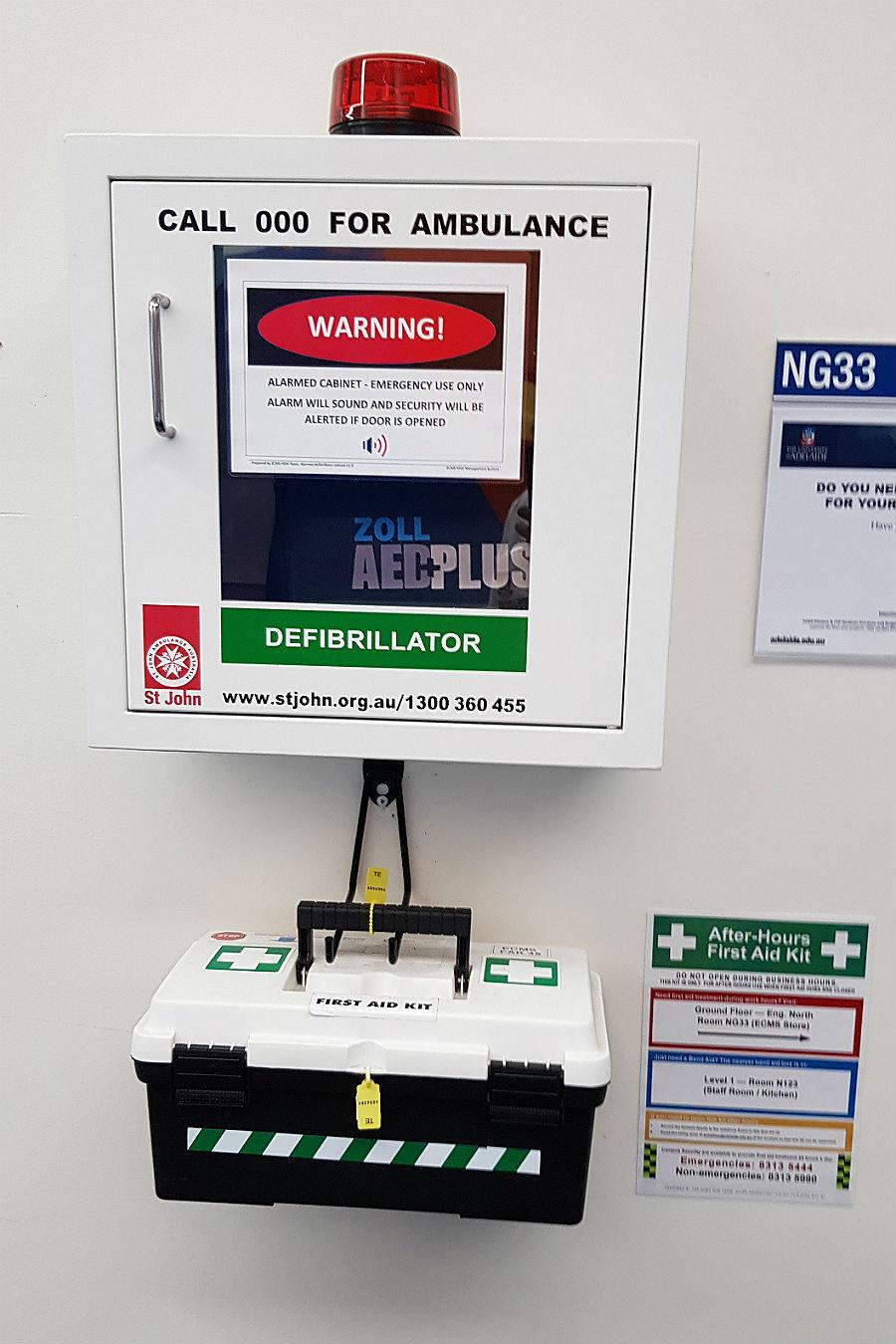 Picture shows a defibrillator machine and the first aid box