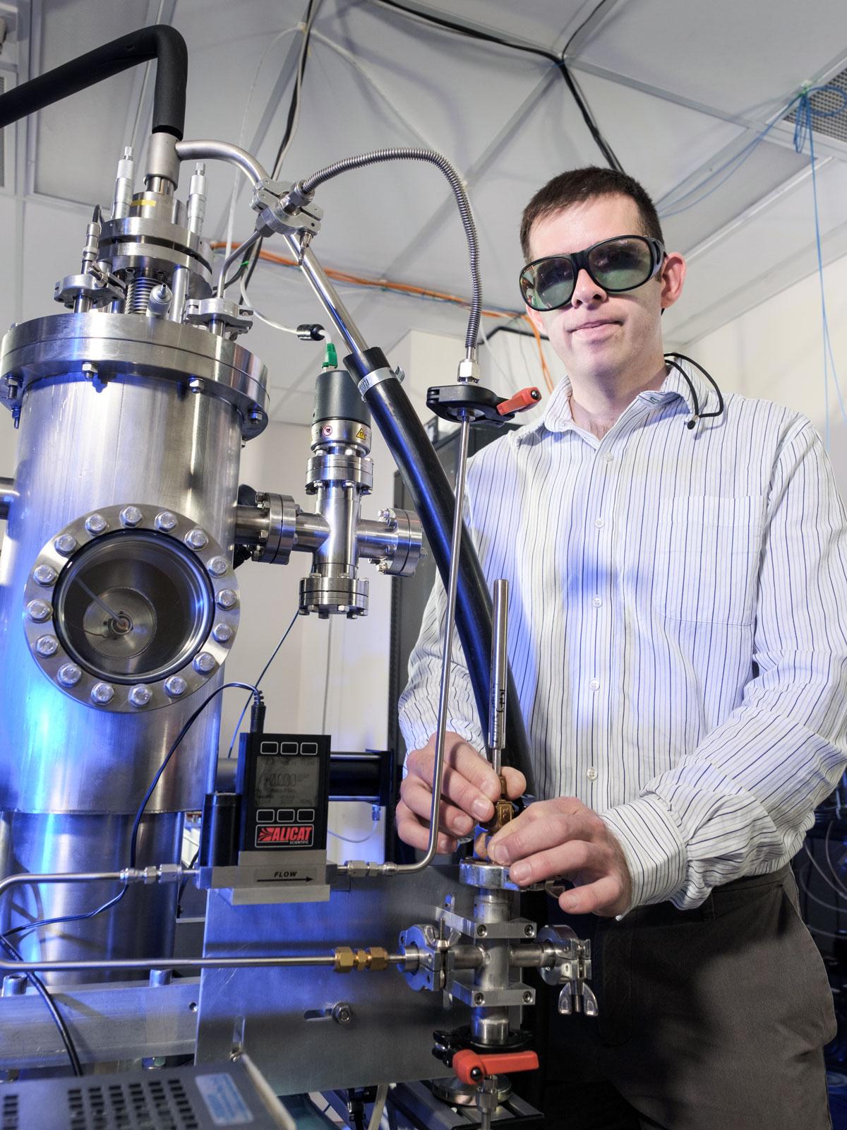 Research fellow Dr Philip Light with the Atom Trap Trace Analysis (ATTA) facility at The University of Adelaide