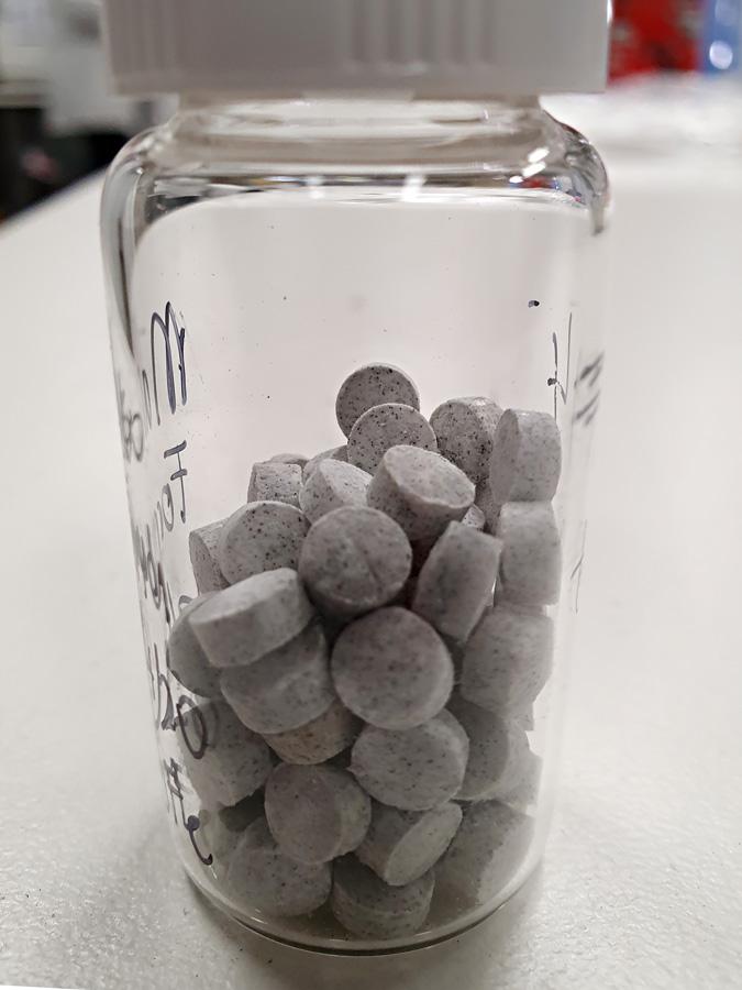 Tablets in a jar to be sent into space by NASA