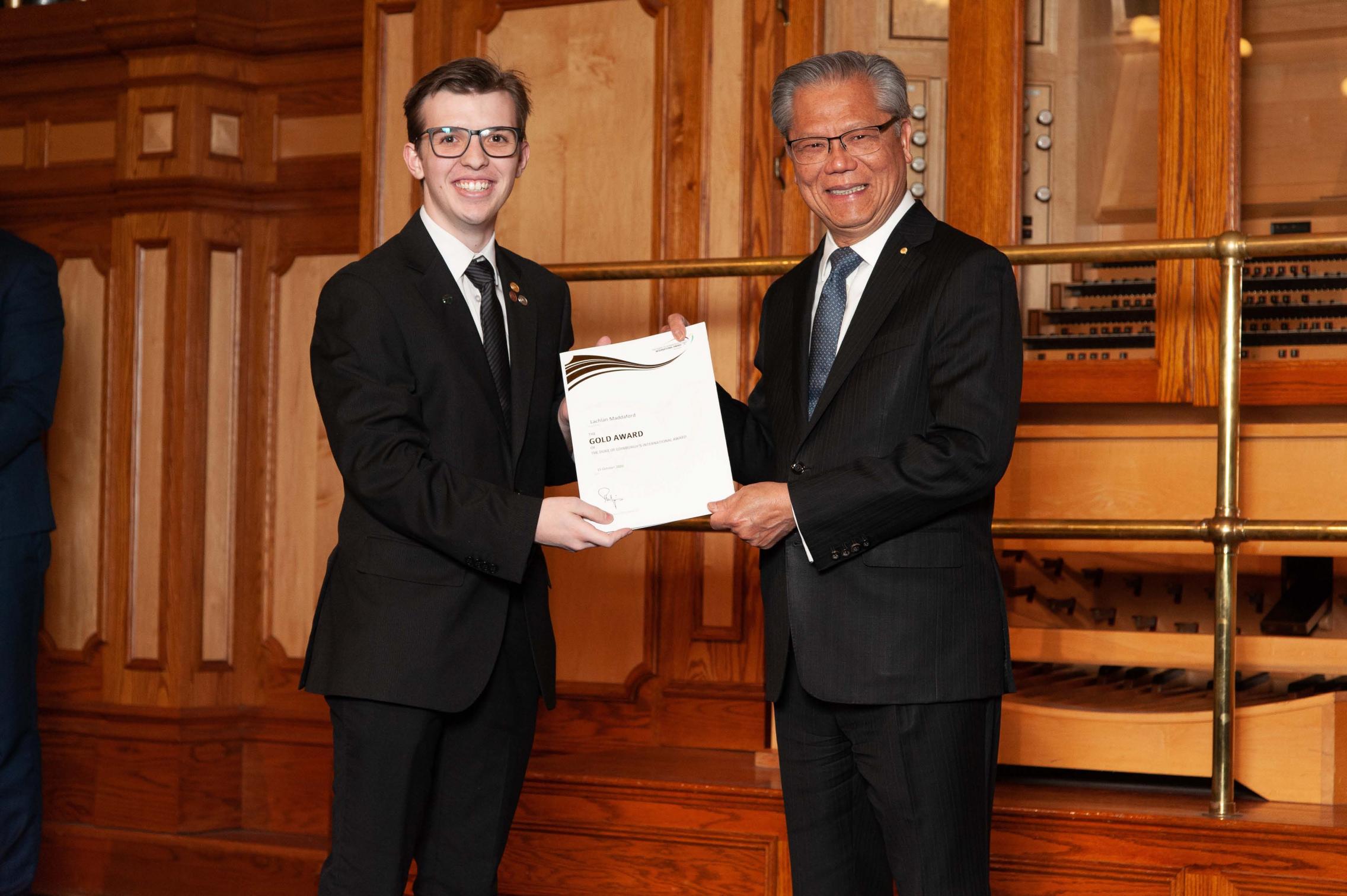 Lachlan Maddaford receiving the Duke of Edinburgh Gold Award from the Governor