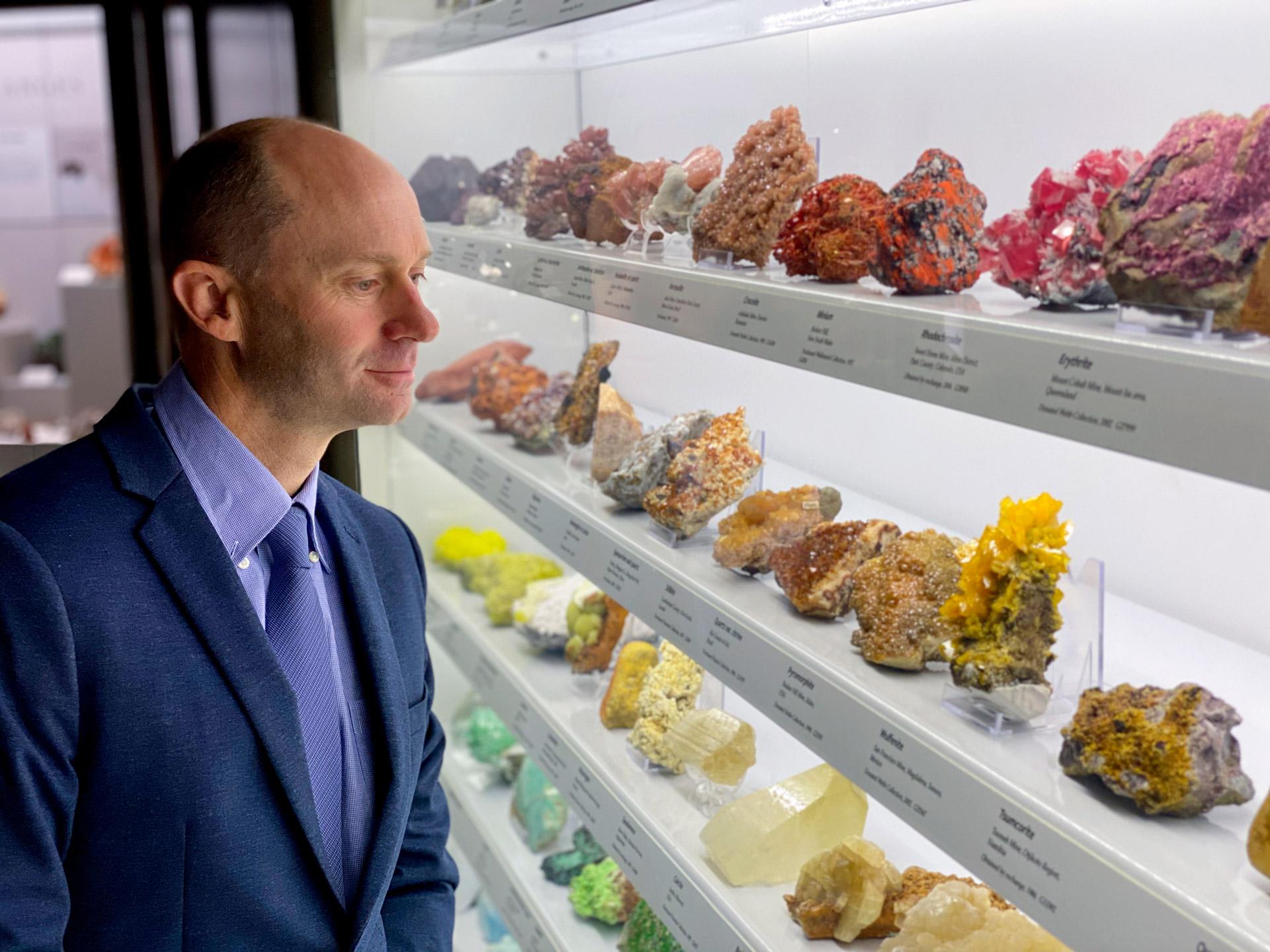Carl Spandler looking at a minerals display at SA Museum