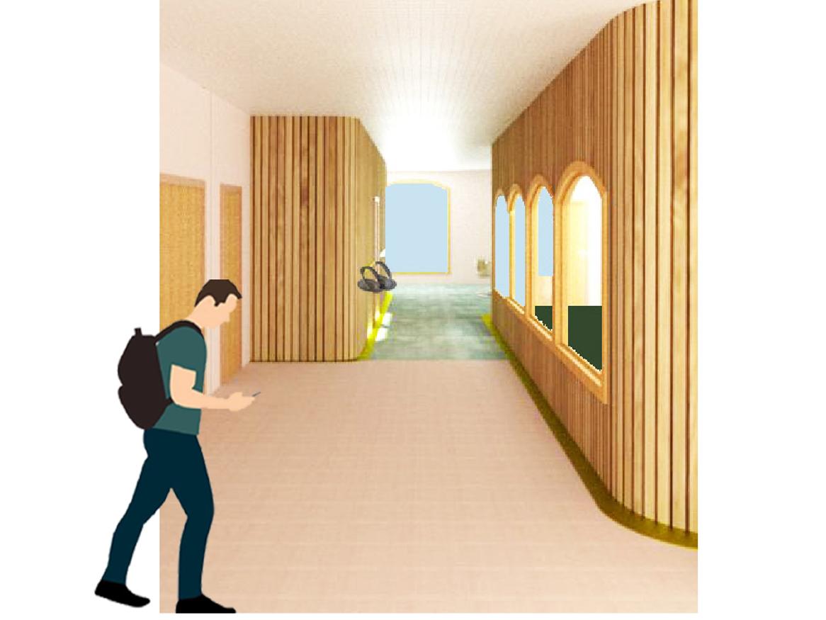 man with backpack on mobile phone walking down corridor with windows