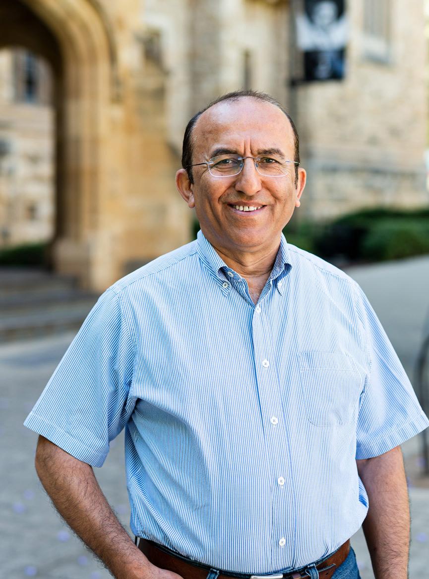 man in a shirt smiling outside