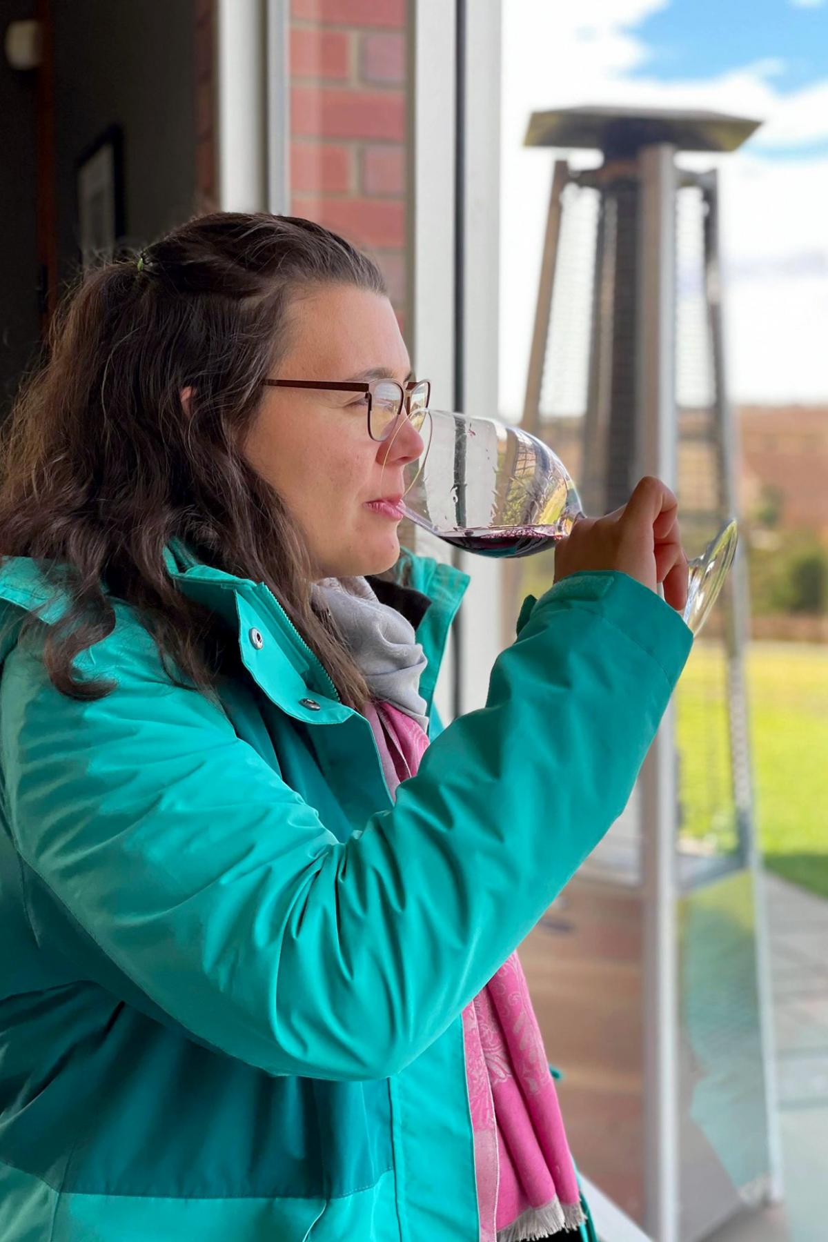 Natalia Caliani drinking wine in the Clare Valley