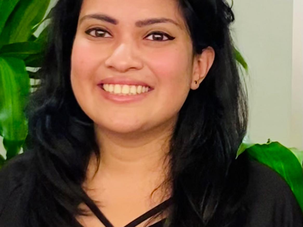 woman wearing black and smiling