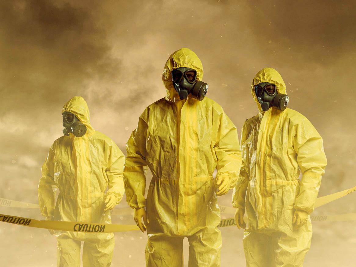 People wearing protective suits as part of biosecurity. iStock image by D Keine. 